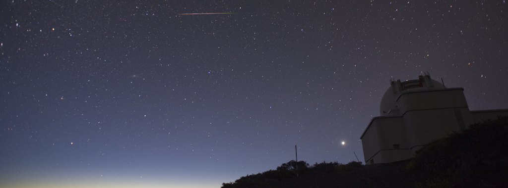 Isaac Newton telescope and meteor stripe at La Palma